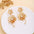Wholesale Retro Flower Pearl Hollow Love Light Luxury Earrings