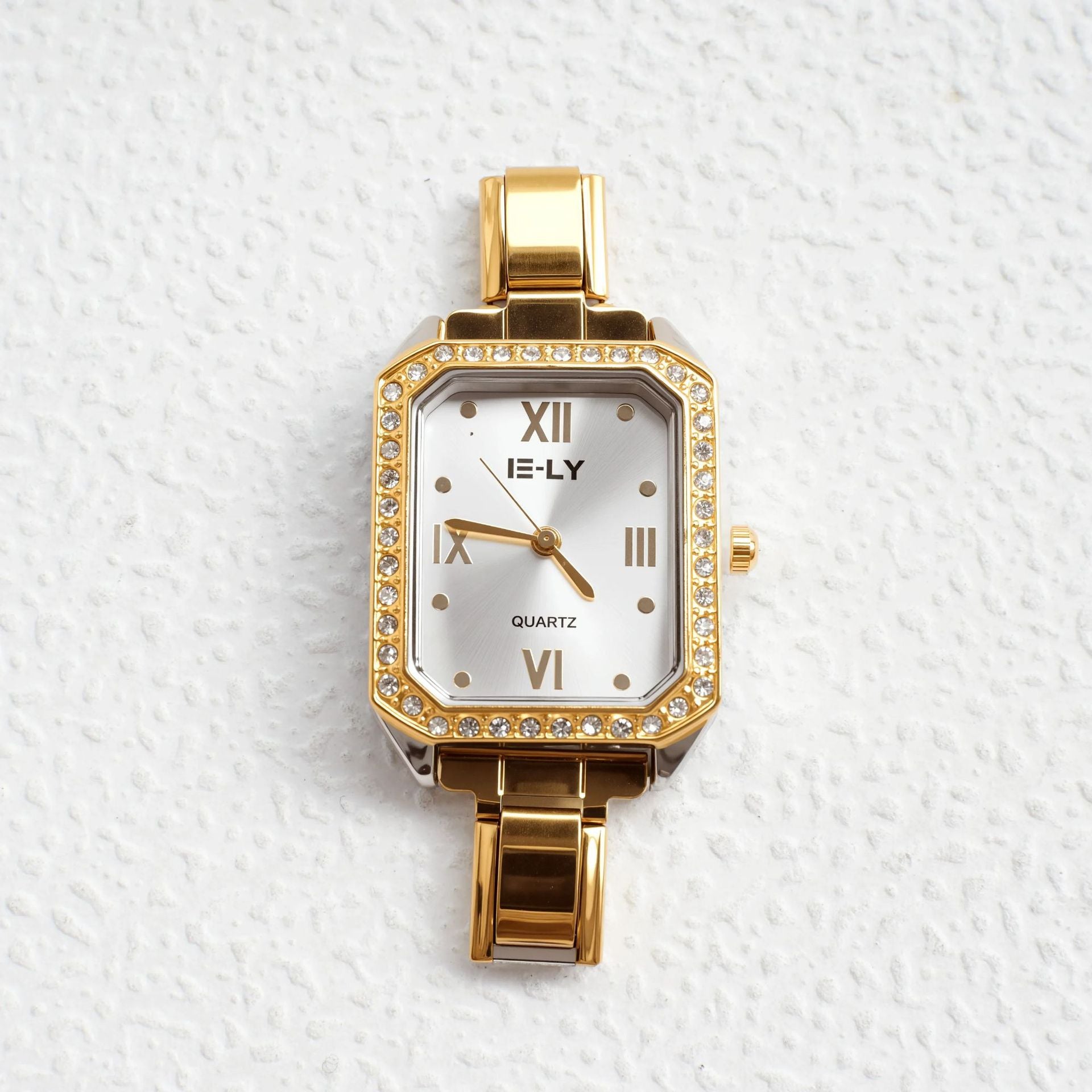 Wholesale quartz gold-rimmed diamond-encrusted watch.