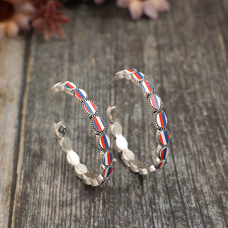 Wholesale American Independence Day C-shaped inlaid acrylic blue,white and red striped alloy earrings