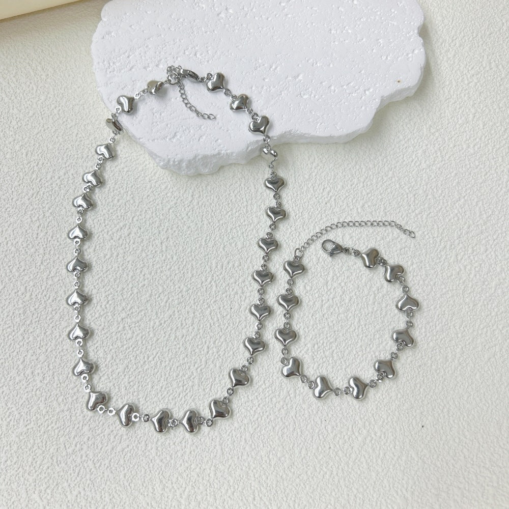 Wholesale Stainless Steel Three-dimensional Hollow Love Bracelet Necklace suit