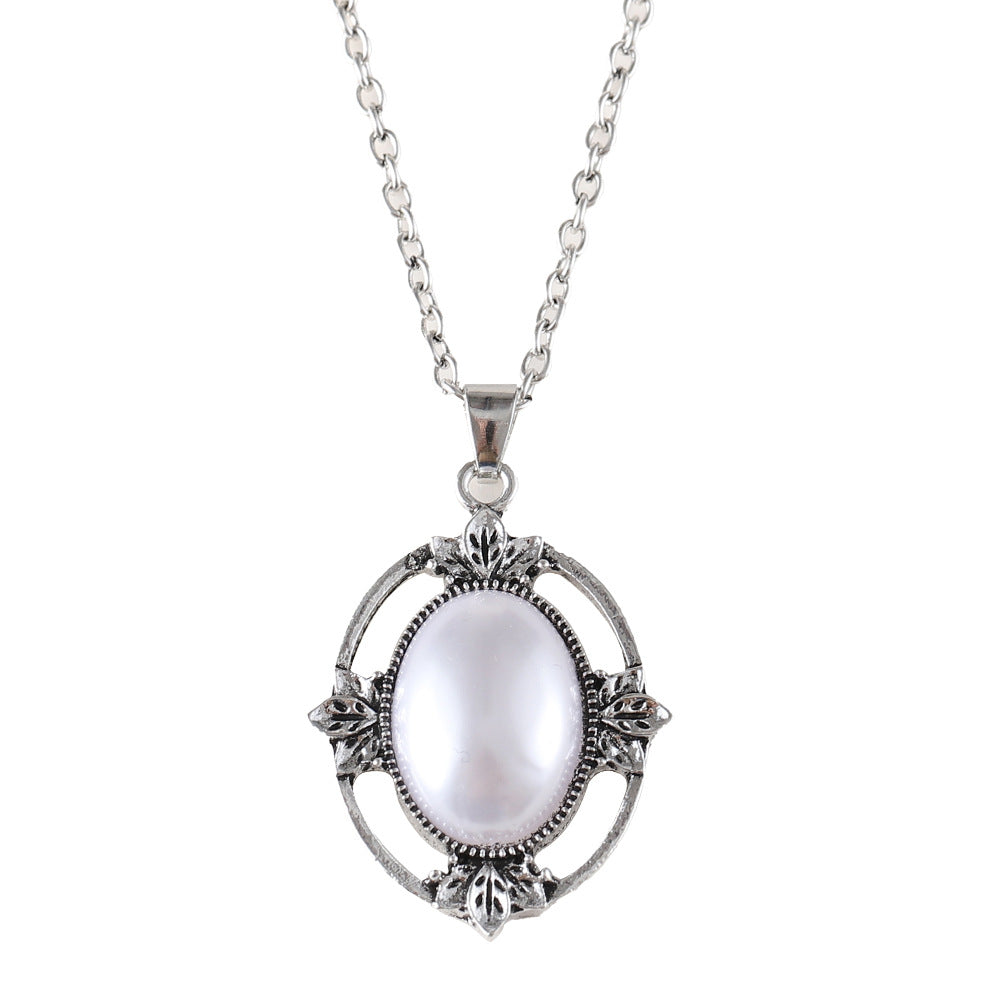 Wholesale Retro Hollow Bohemian Style Inlaid Oval Pearl Alloy Pendant Necklace