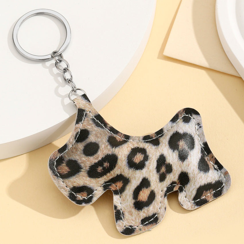 Wholesale New keychain pendant PU cotton-filled leopard print puppy car pendant bag pendant new couple heart pendant.