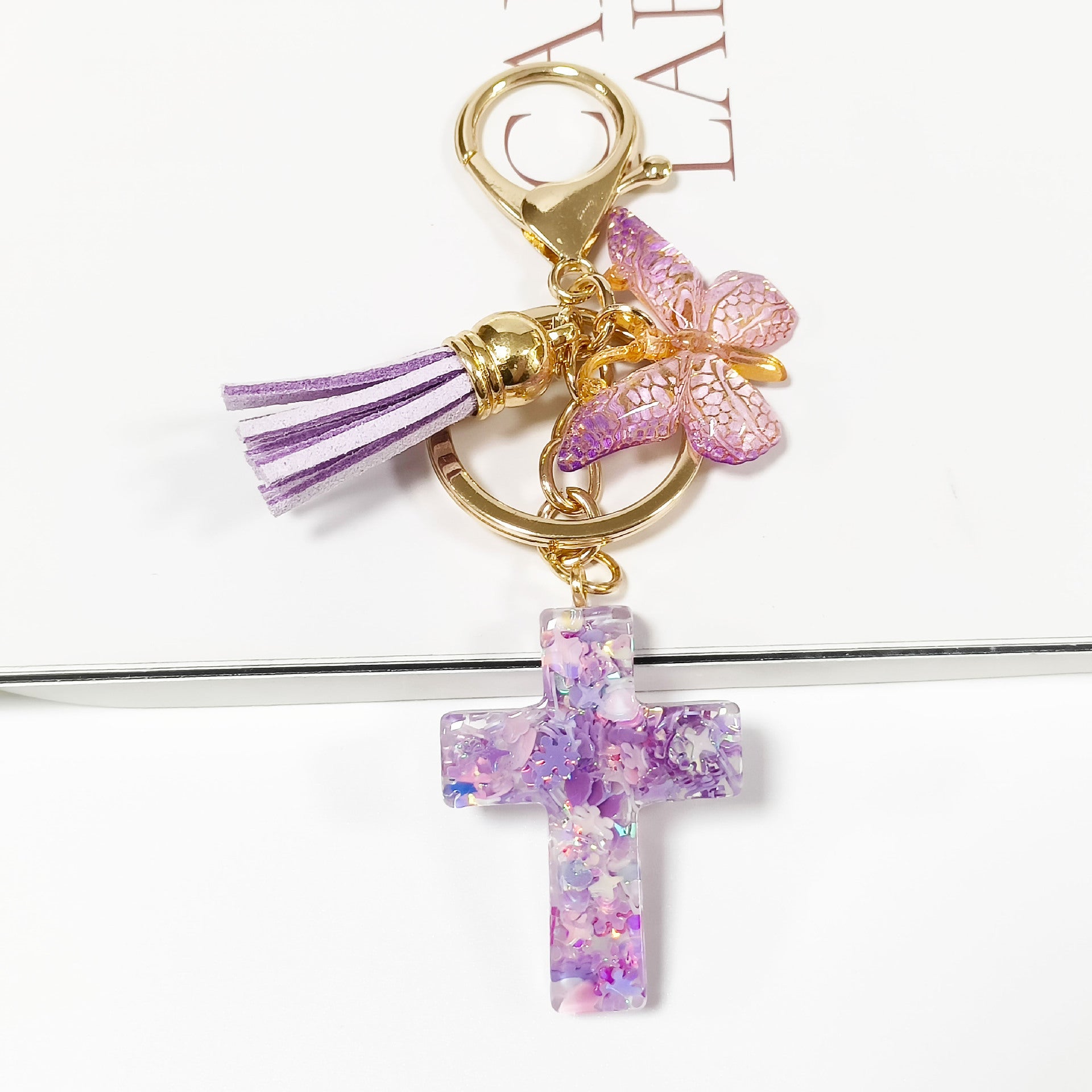 Wholesale Resin glue cross butterfly white blue tassel keychains