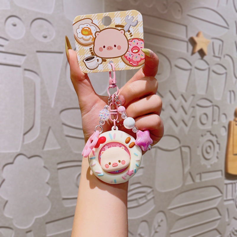 Wholesale Cute cartoon PVC pig spinning donut keychain