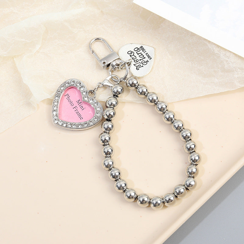 Wholesale Diamond-inlaid five-pointed star tag metal texture dog bone keychain