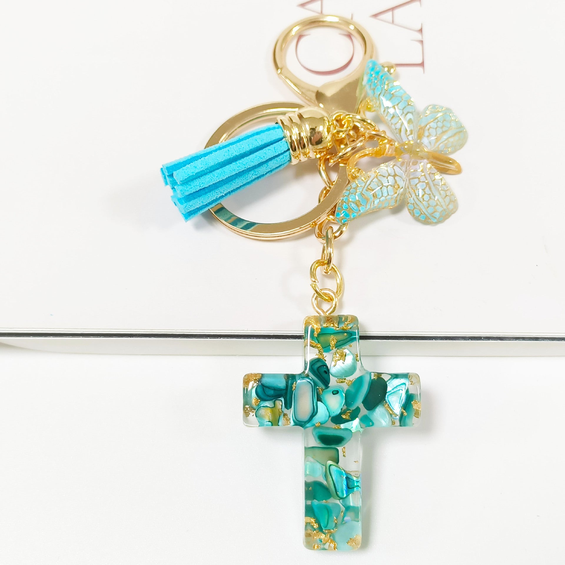 Wholesale Resin glue cross butterfly white blue tassel keychains