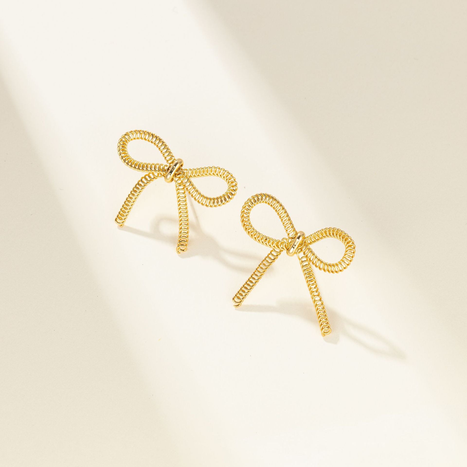 Wholesale Metal Bow Tassel Earrings