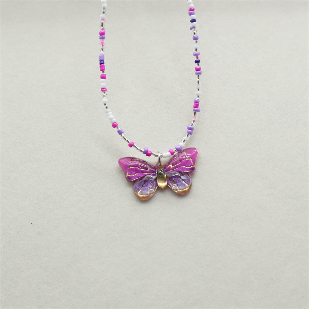 Wholesale gradient color bronzing butterfly sweet pendant rice beads beaded necklace