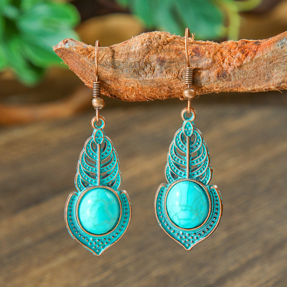 Wholesale Retro Bohemian Turquoise Heart Hollow Leaves Alloy Earrings for Party Wear Boutique Resale Jewelry