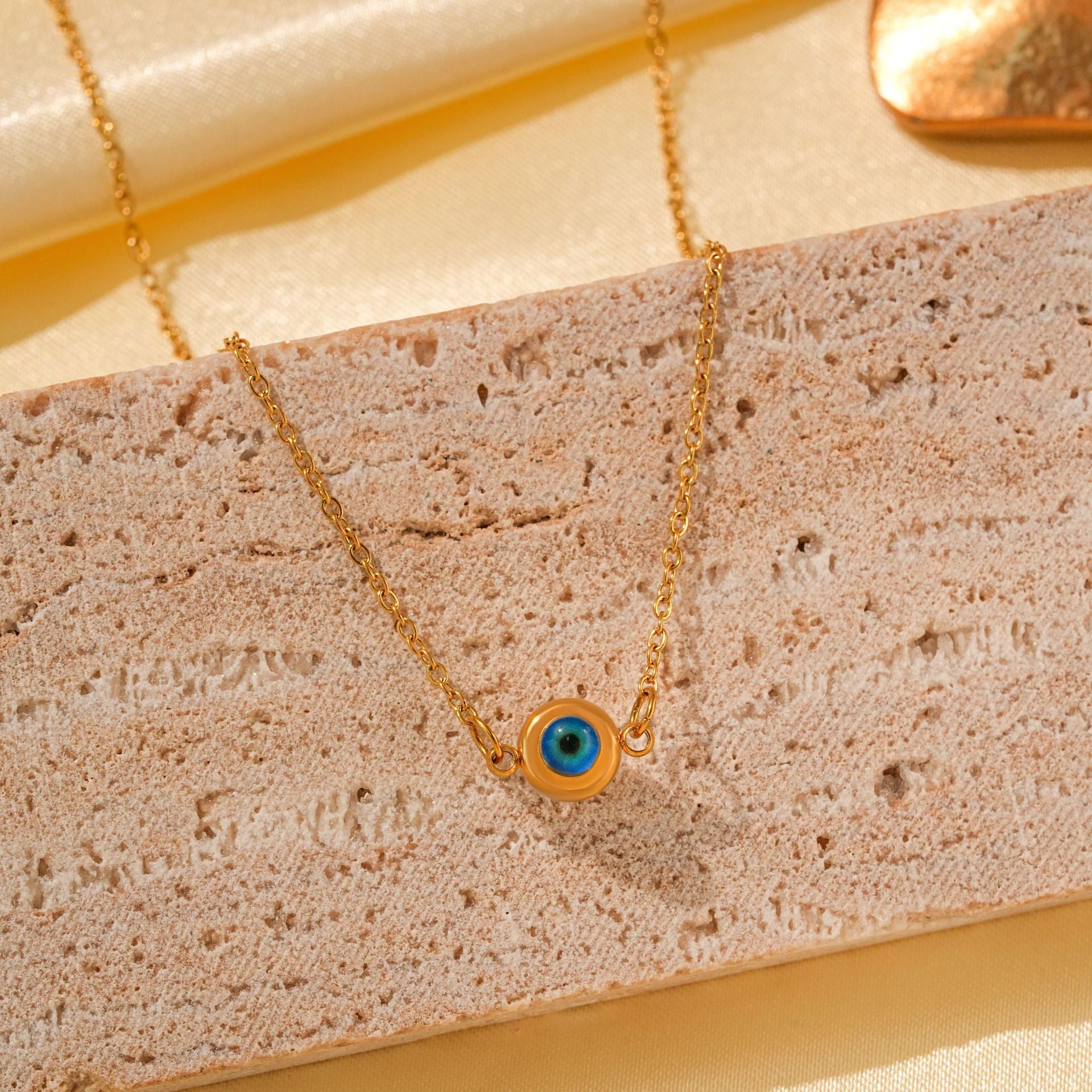 Wholesale Titanium Steel Retro Hip-hop Blue Devil's Eye Bow Love Pendant Evil Eye Necklace