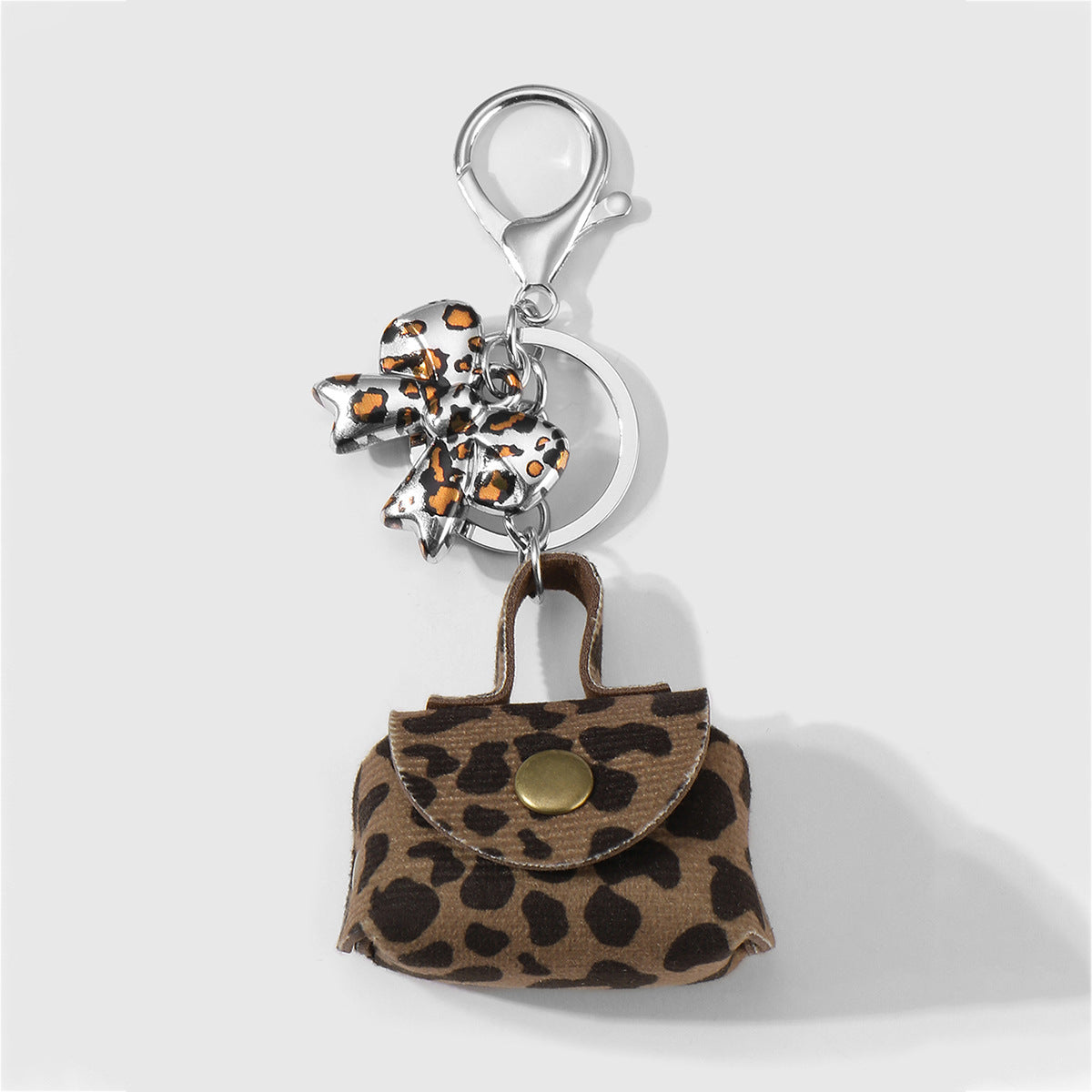 Wholesale Zinc alloy leopard print bowknot heart-shaped earphone case keychain