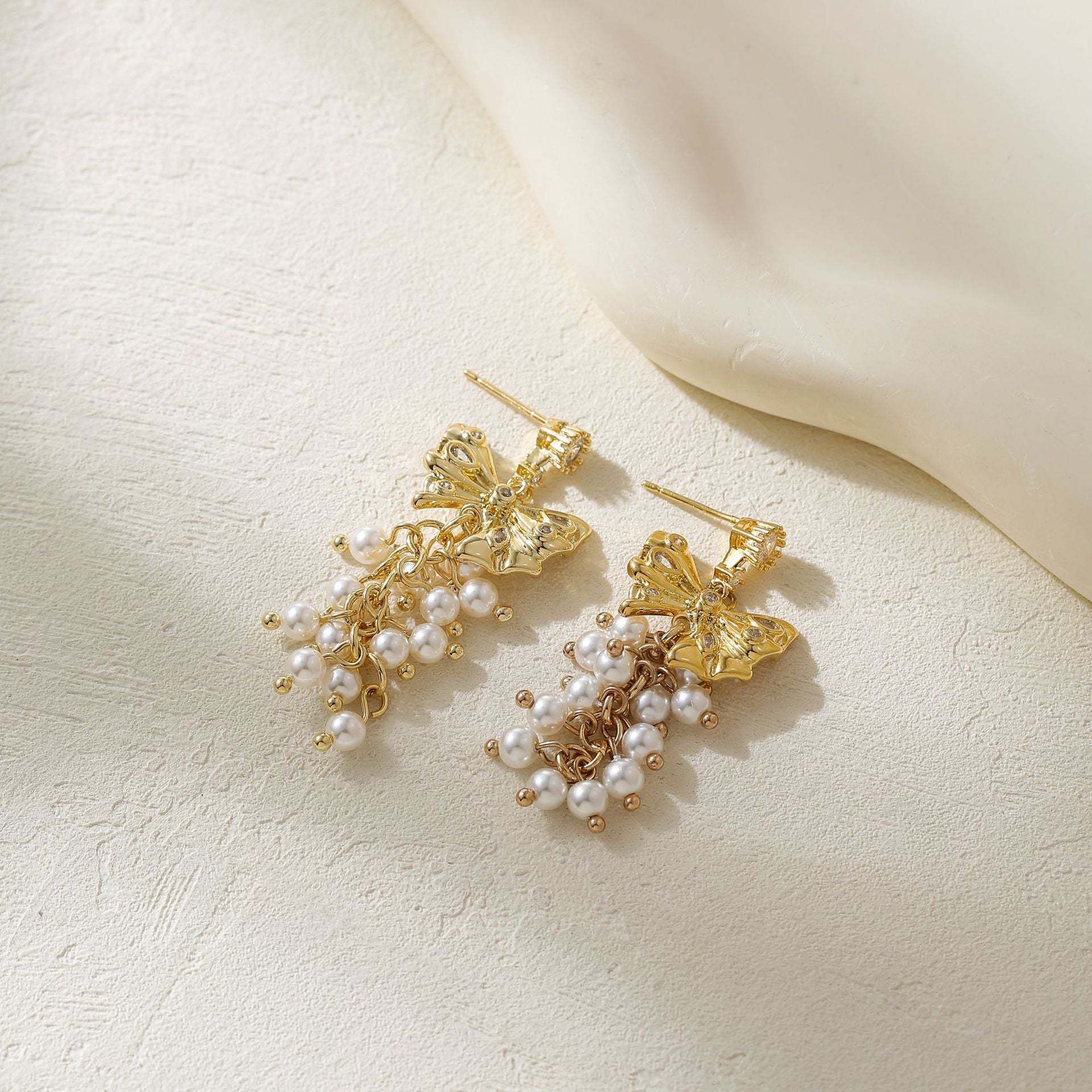 Wholesale Metal Bow Tassel Earrings