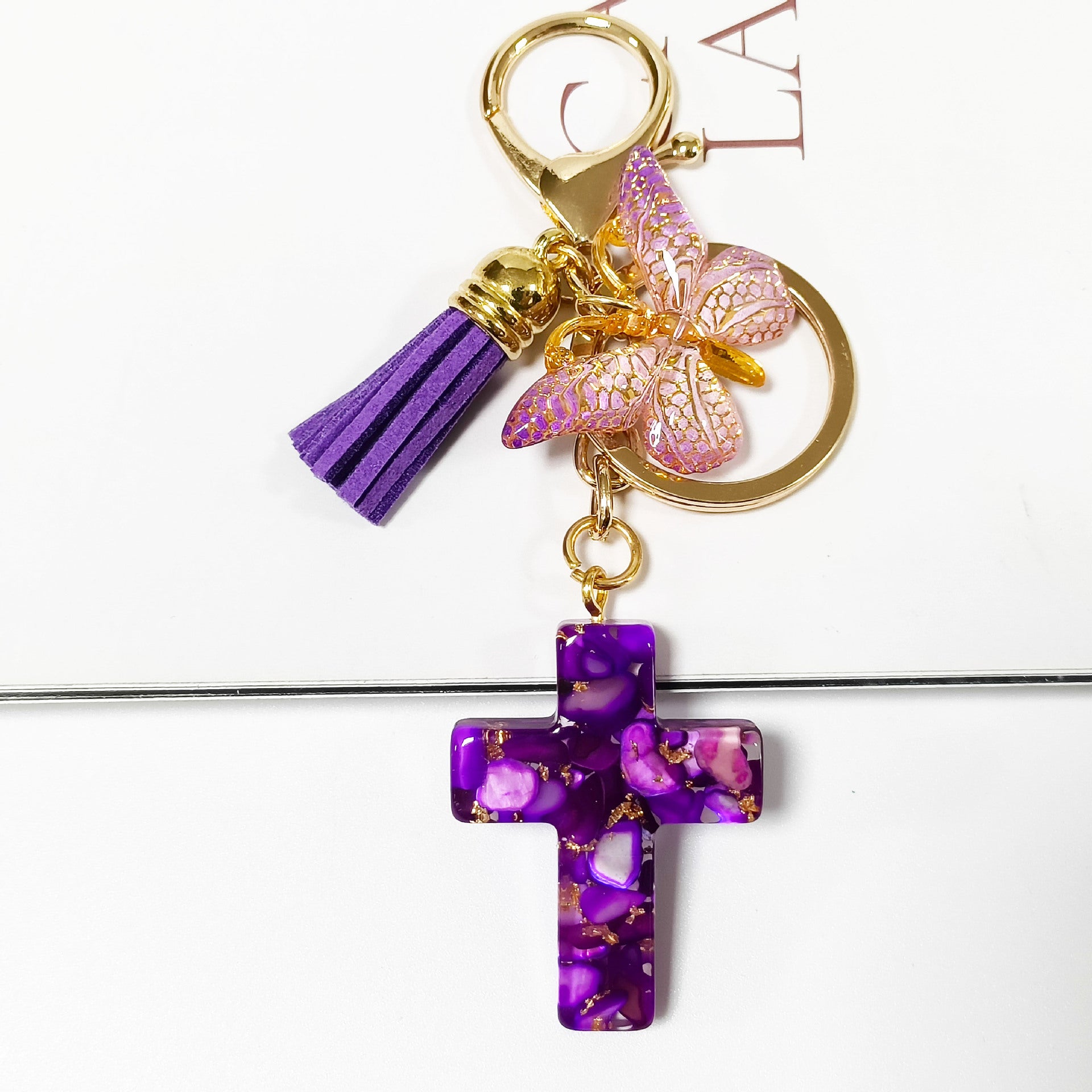 Wholesale Resin glue cross butterfly white blue tassel keychains