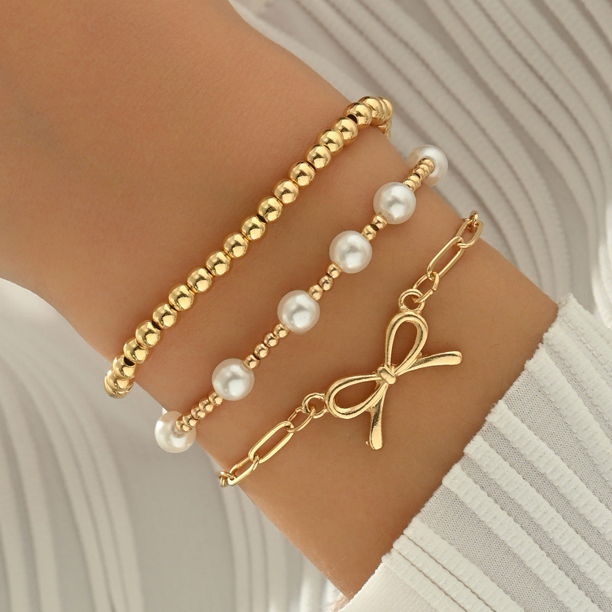 Wholesale Alloy pearl chain and bowknot layered bracelet set for women