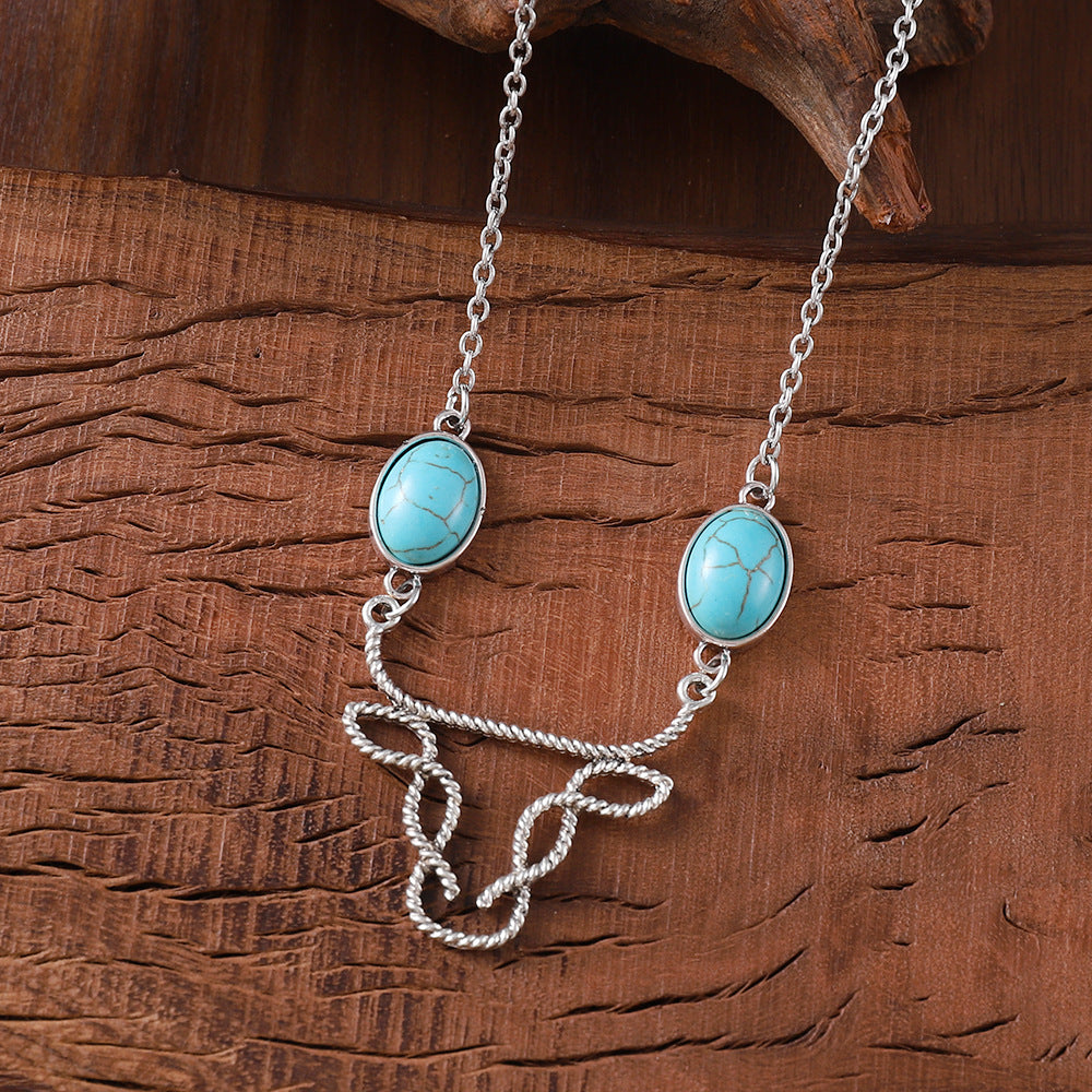 Wholesale inlaid turquoise cow head necklace Bohemian hollow  jewelry