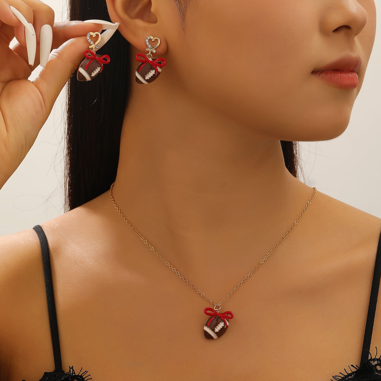 Wholesale sports style football love bow  necklace