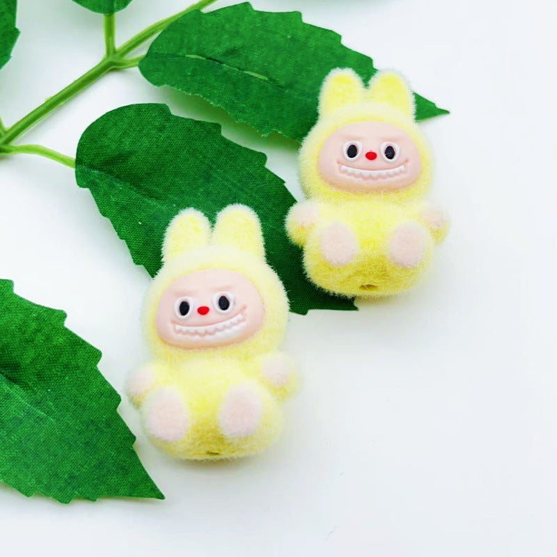 Wholesale 10pcs cartoon flocking sitting doll with beads