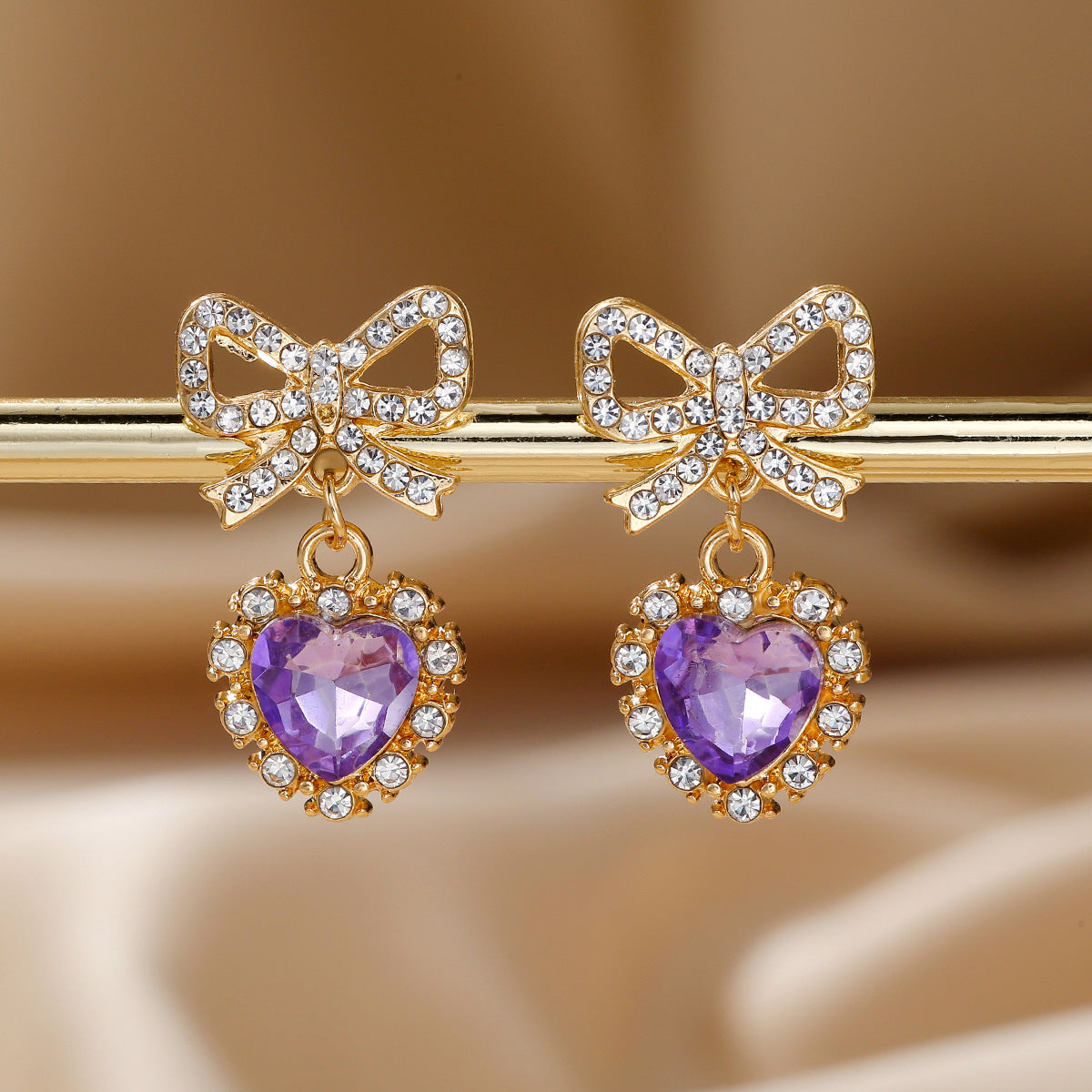 Wholesale Zinc alloy heart-shaped bow earrings with rhinestones