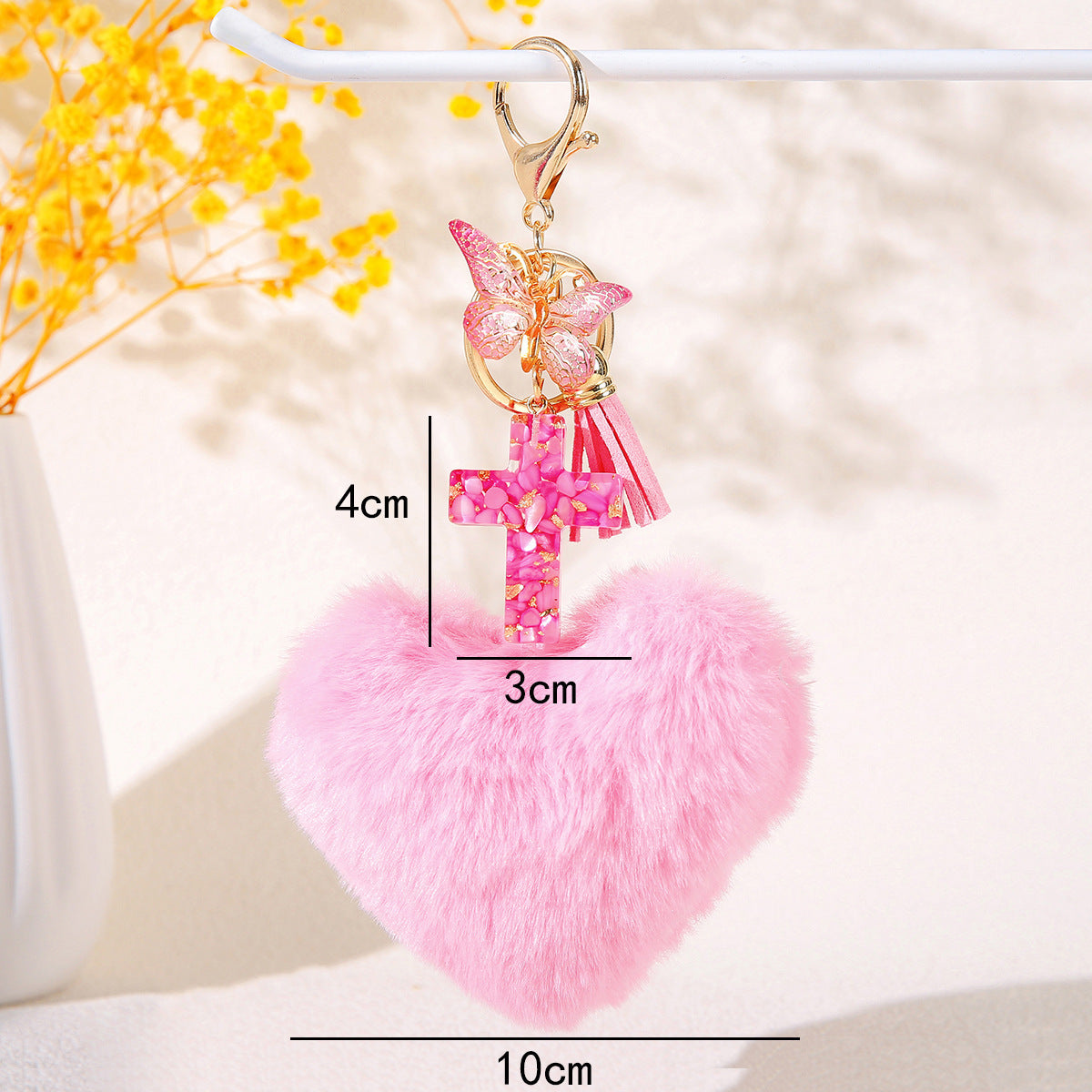 Wholesale Resin butterfly cross keychain with heart-shaped pom-pom