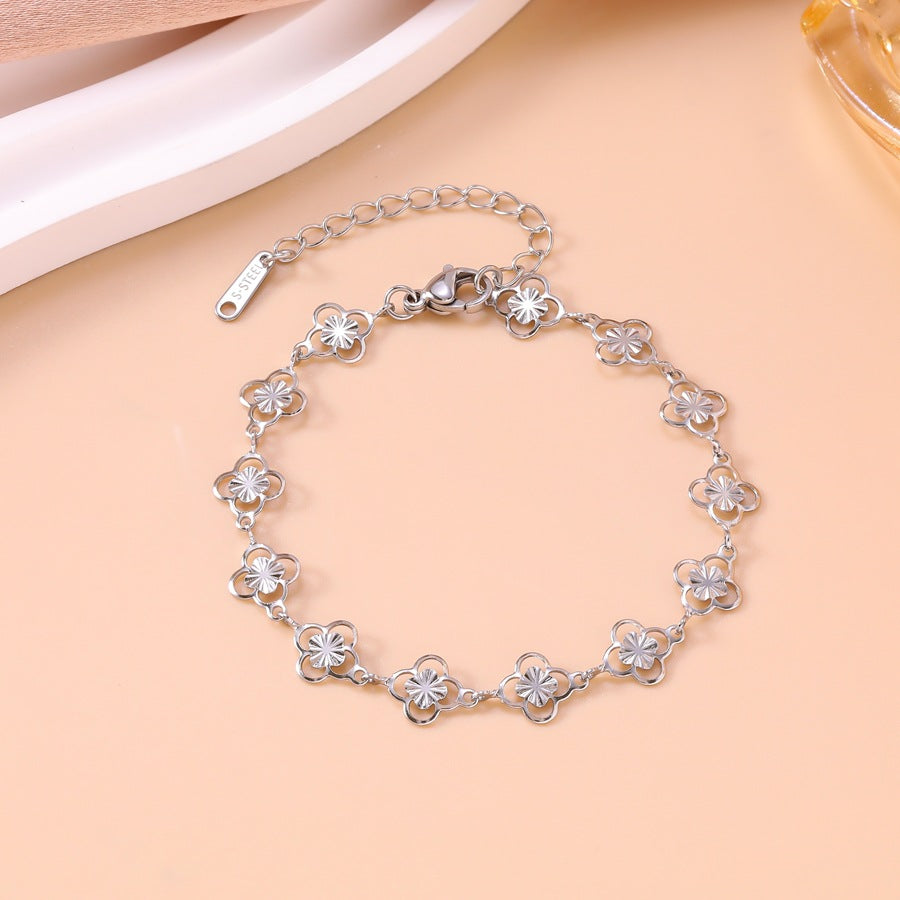 Wholesale Openwork floral four-leaf clover bracelet and necklace