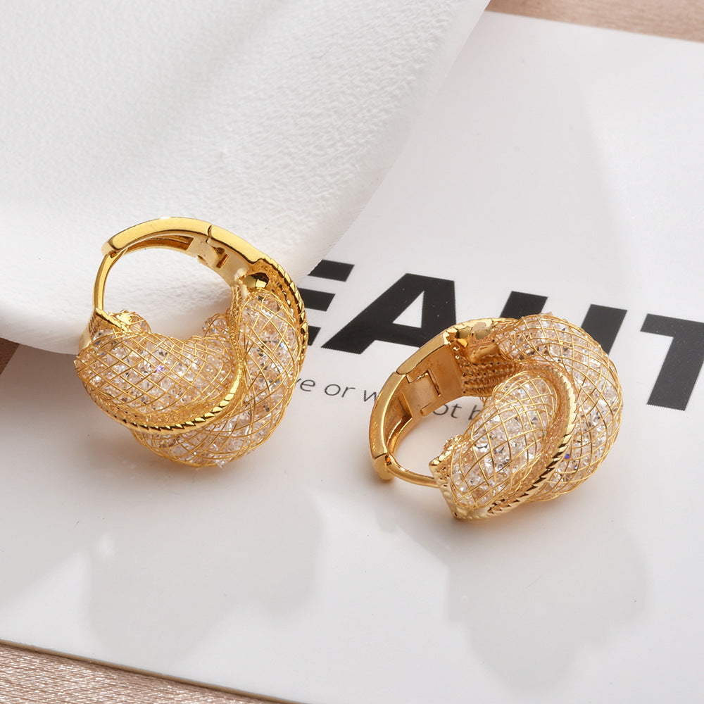 Wholesale Light luxury hollow twist earrings with glittering crystal wrap earrings