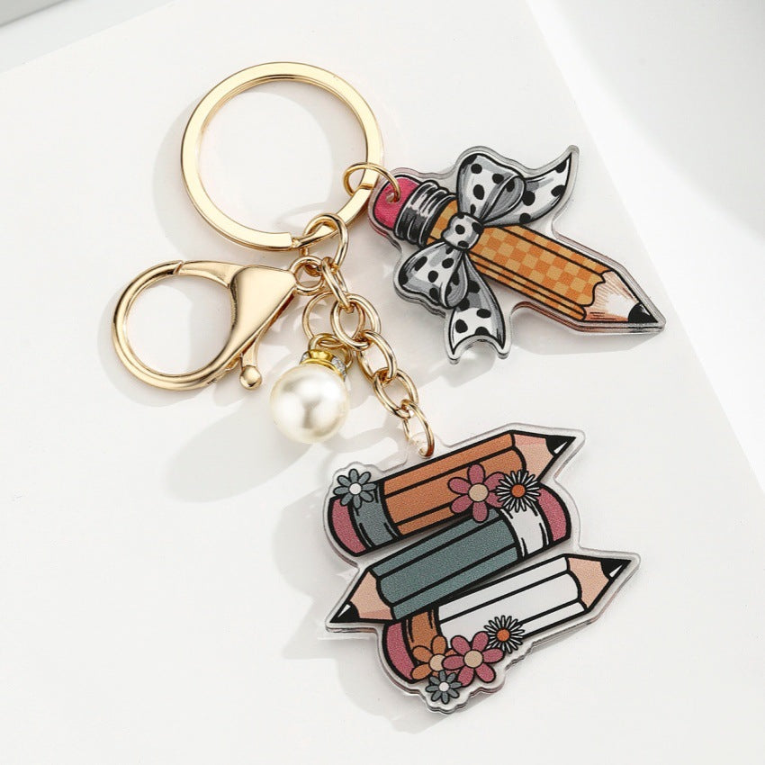 Portachiavi a matita con slogan e lettera di perle di libro acrilico all'ingrosso