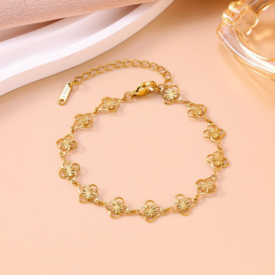 Wholesale Openwork floral four-leaf clover bracelet and necklace