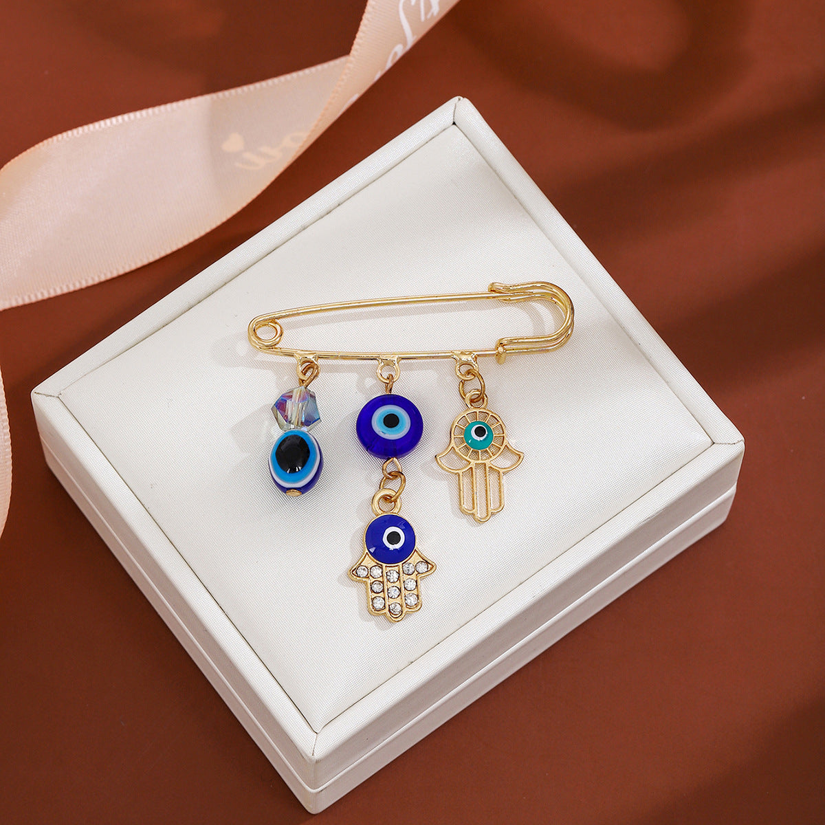 Wholesale Diamond-encrusted Devil' s Eye Tassel Brooch