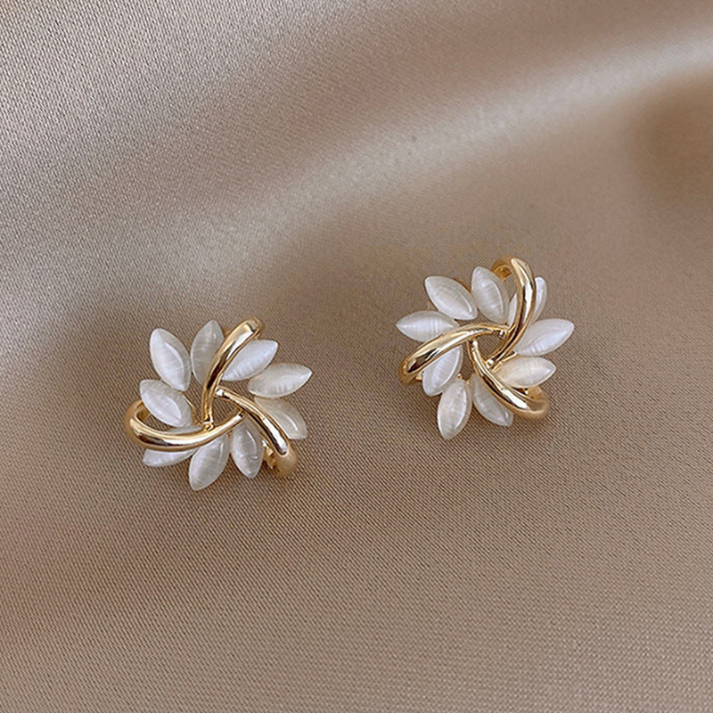 Wholesale S925 Silver Needle Rotating Flower Cat's Eye Stone Sun Earrings