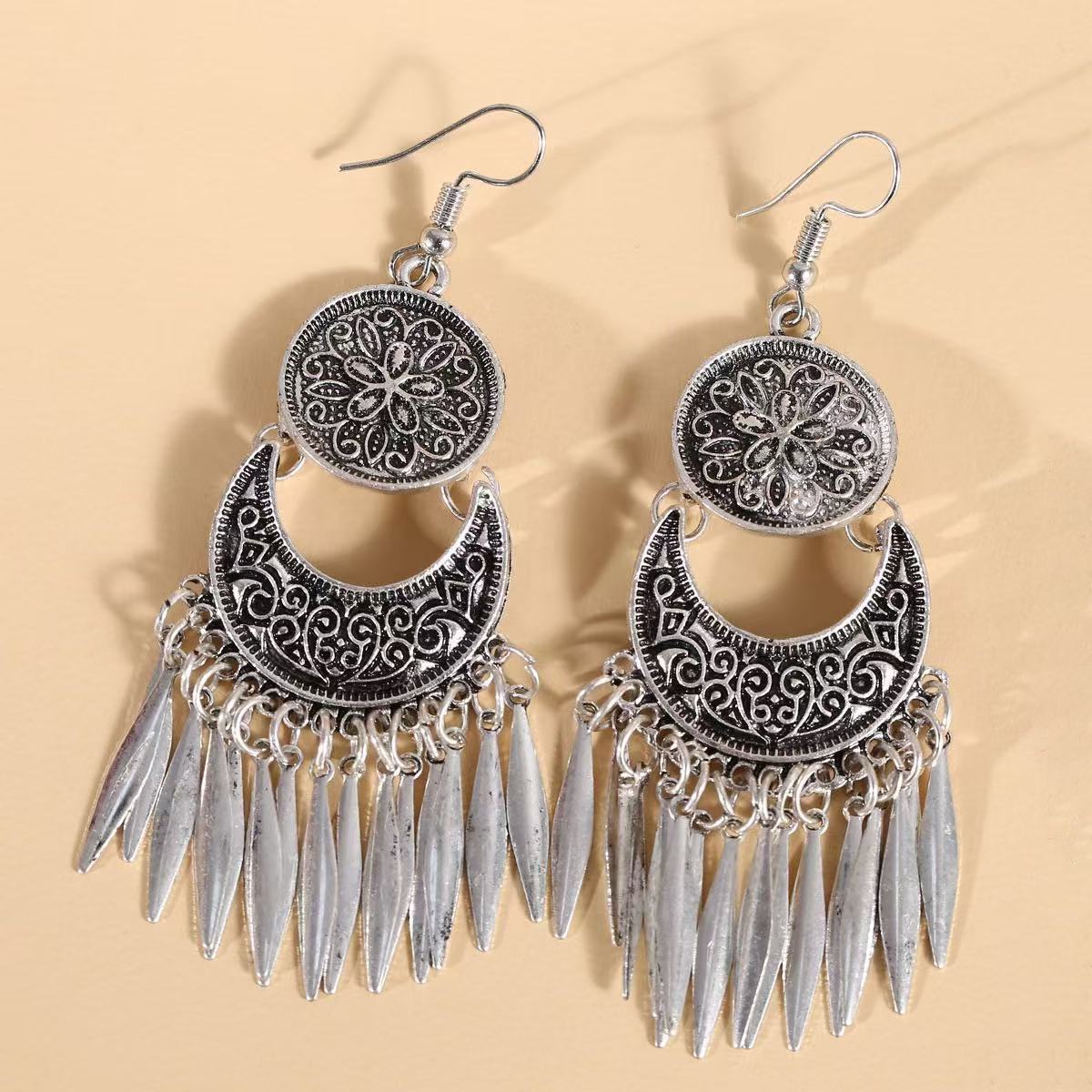 Wholesale Bohemian hollow  carved long tassel earrings