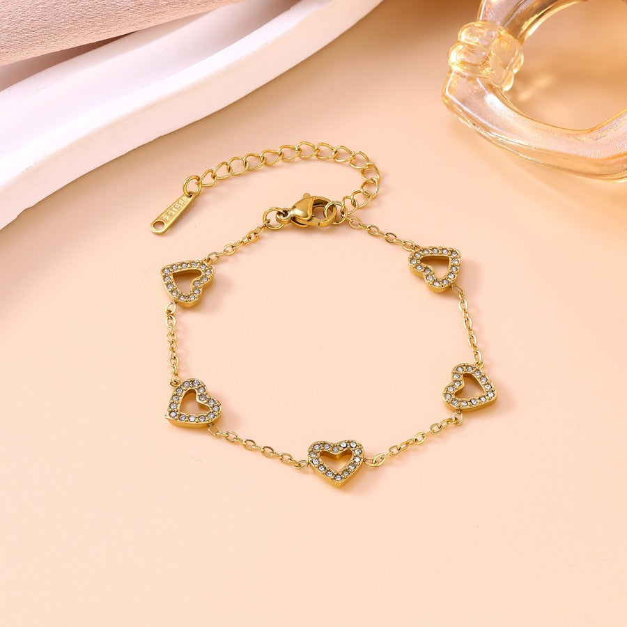Wholesale Light Luxury Diamond-Encrusted Hollow Heart Jewelry Set - Titanium Steel Bracelet,  Necklace,  Earrings,  Boutique Resale Gift