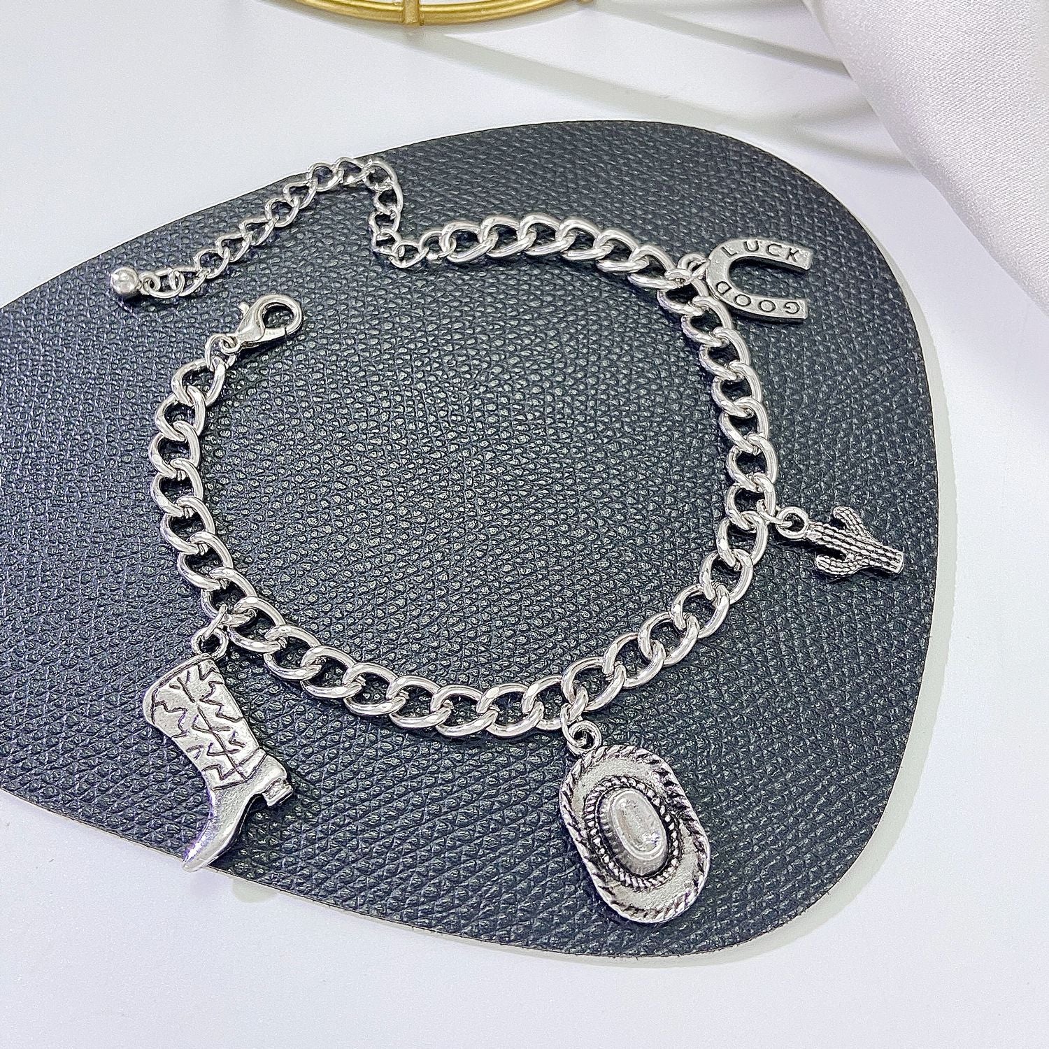 Wholesale Leather boots,  cowboy hat,  bracelet necklace ring