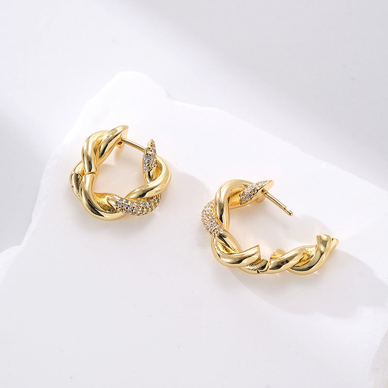 Wholesale twist earrings plain ring light luxury copper plated gold earrings