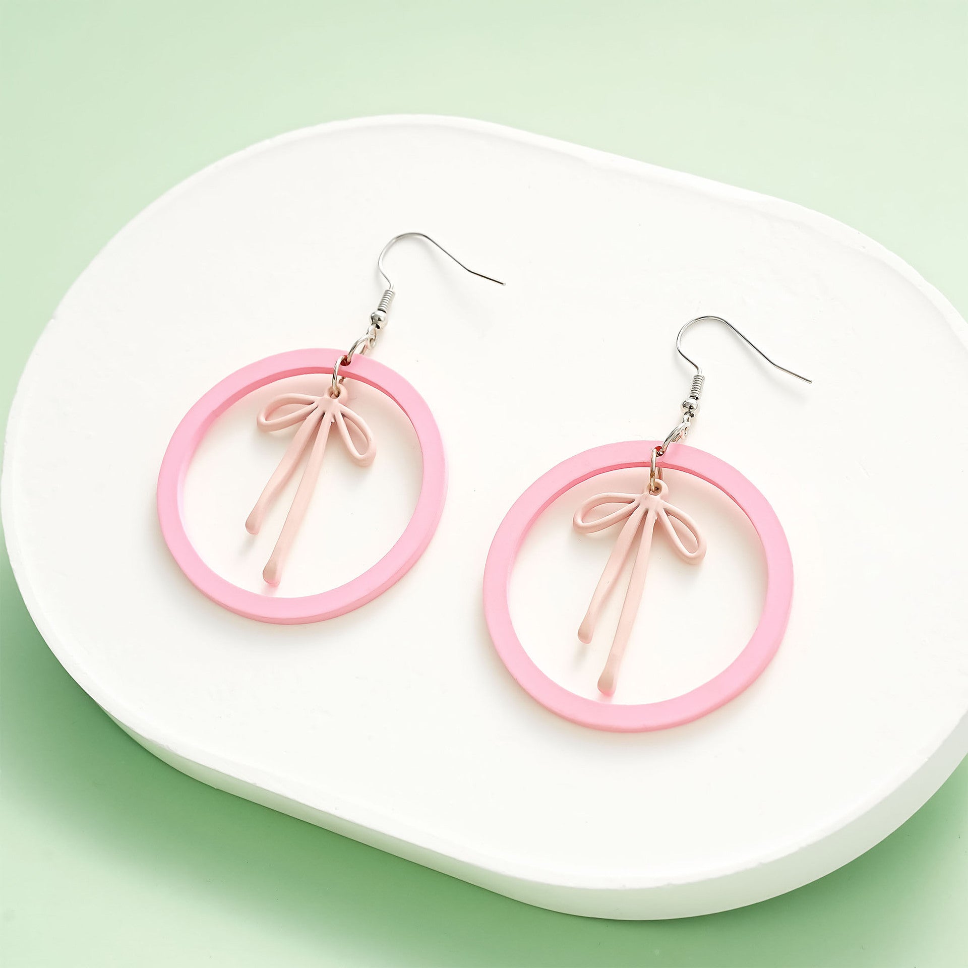 Wholesale acrylic earrings cute pink circle alloy spray-painted bow earrings