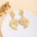 Wholesale Retro Flower Pearl Hollow Love Light Luxury Earrings