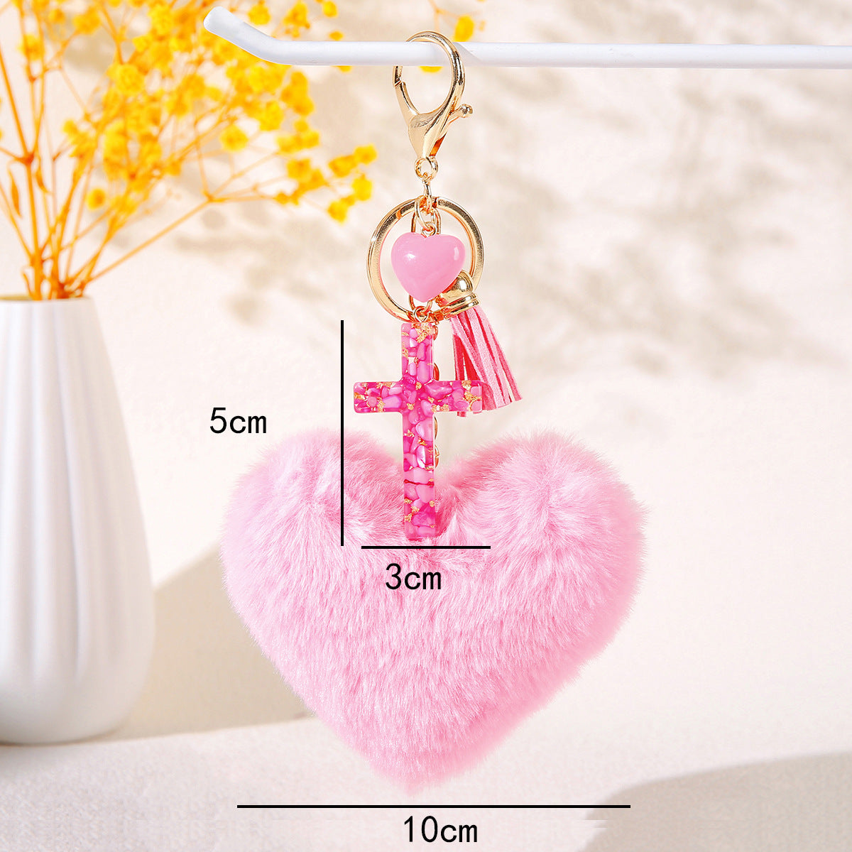 Wholesale Resin butterfly cross keychain with heart-shaped pom-pom