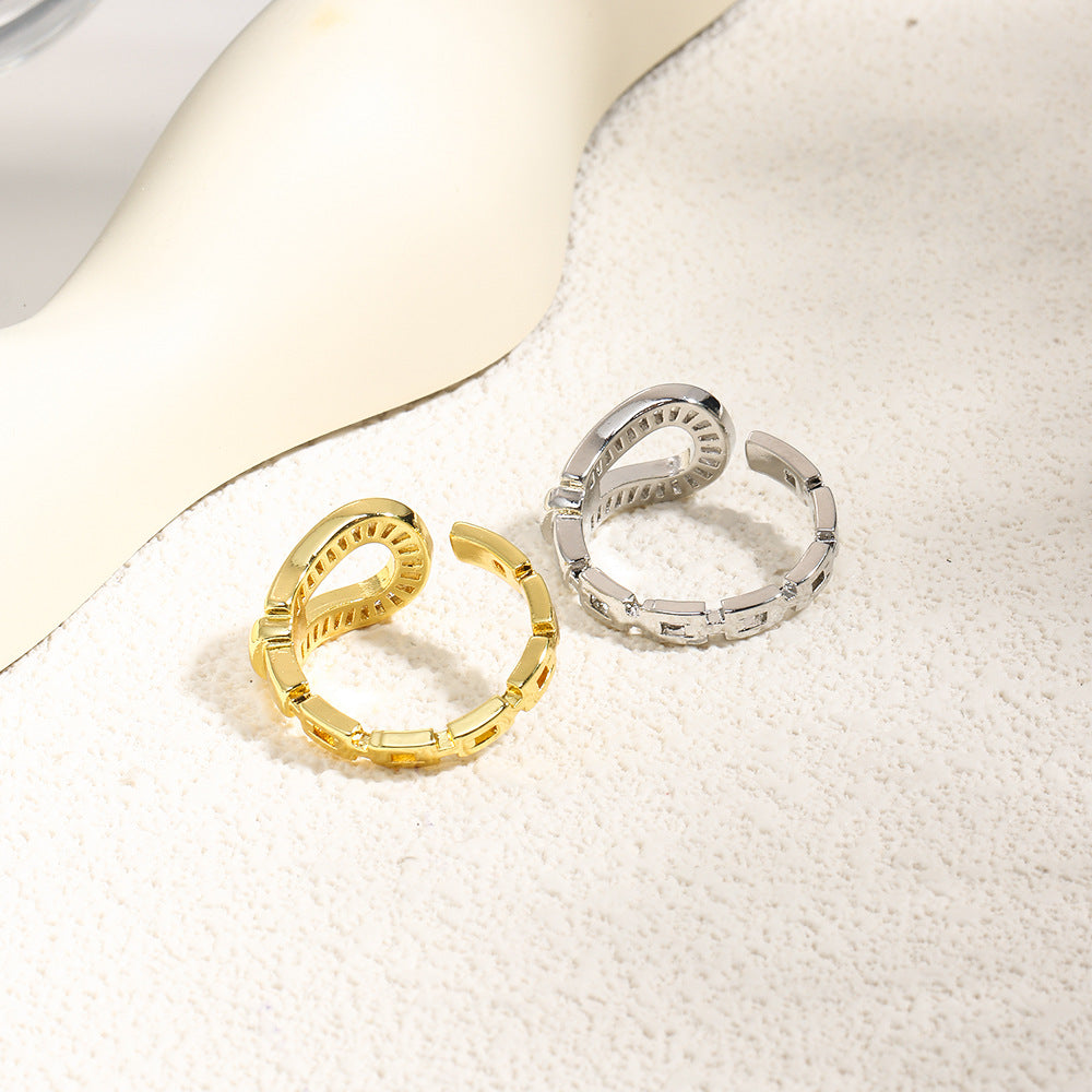 Wholesale Hollow inlaid stepped zircon horseshoe ring