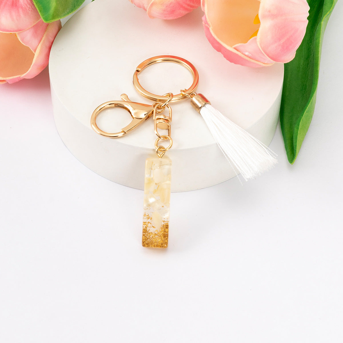 Wholesale Gold Foil New Resin Crystal Glue White Tassel Color English Digital Keychain