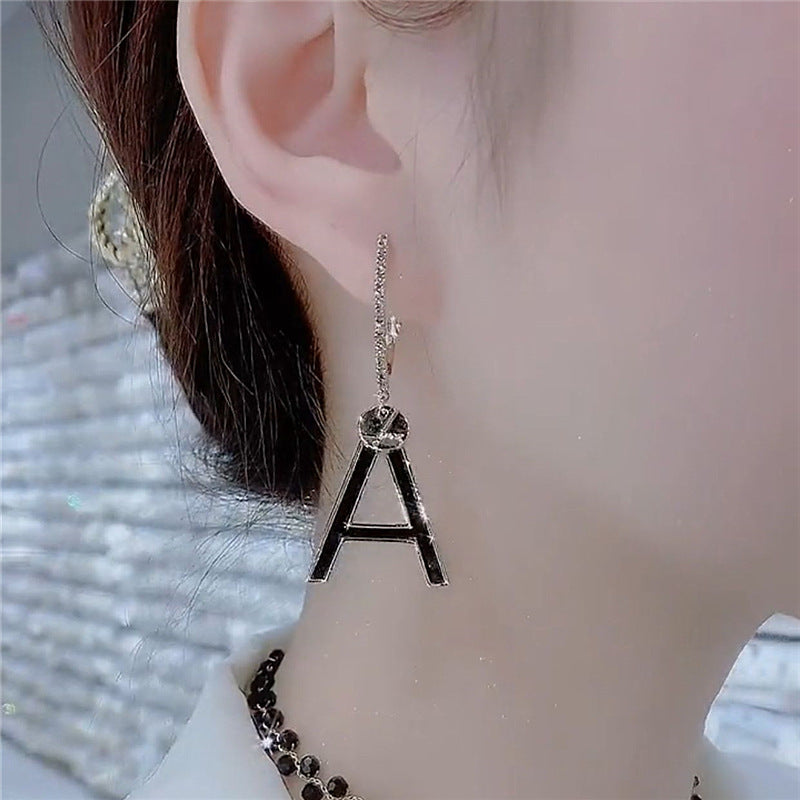 Wholesale Asymmetrical letter tassel earrings