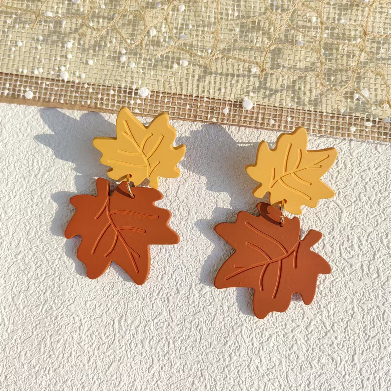 Wholesale Acrylic maple leaf stitching exaggerated cute earrings