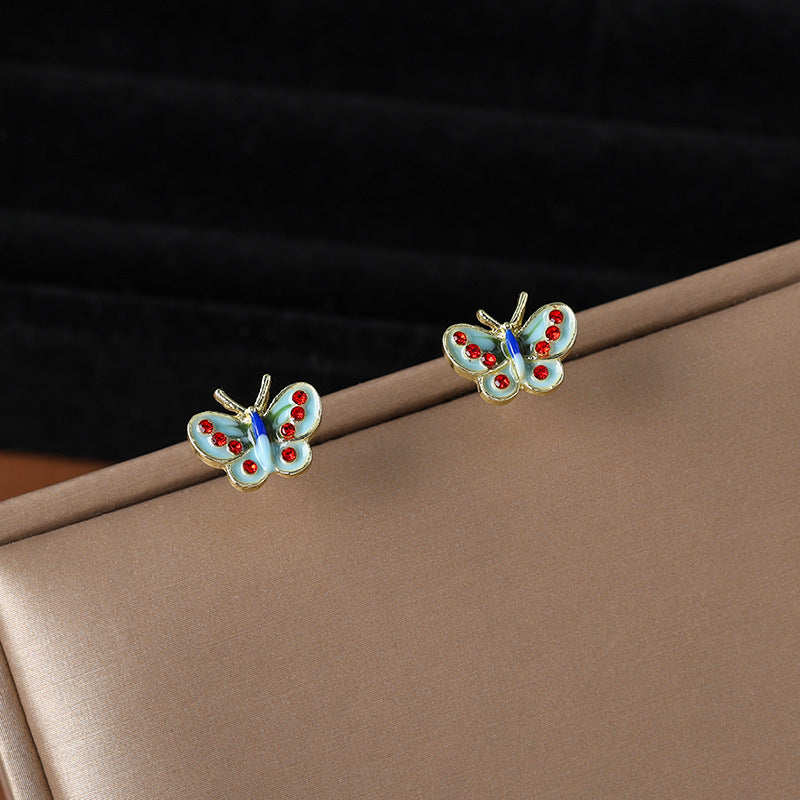 Wholesale drip glaze blue small butterfly diamond earrings