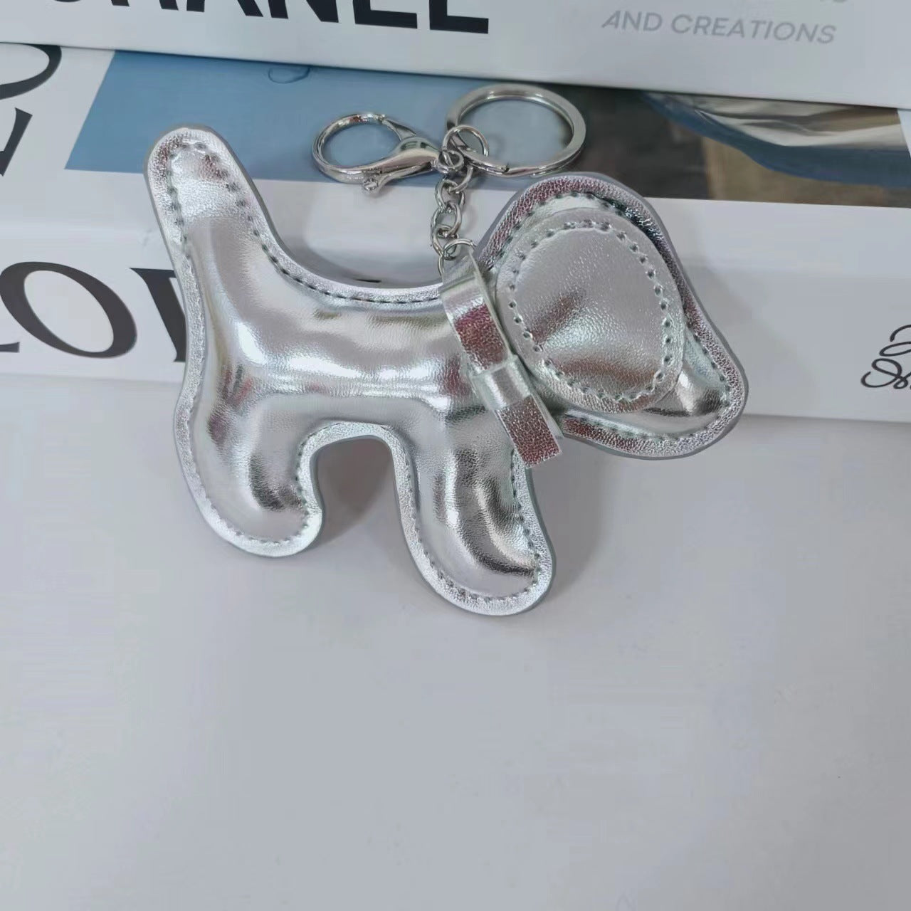 Wholesale Cute Bow Metallic Red Leather Puppy Keychain Bag Charm Boutique Resale
