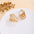 Wholesale Retro Flower Pearl Hollow Love Light Luxury Earrings