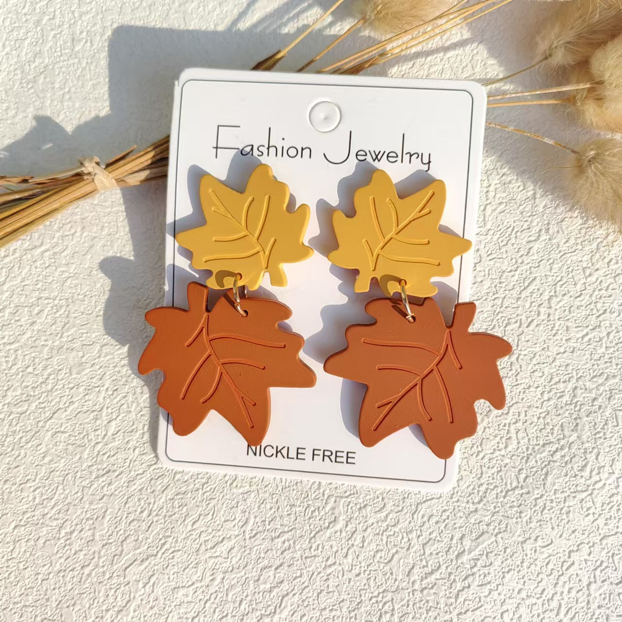 Wholesale Acrylic maple leaf stitching exaggerated cute earrings