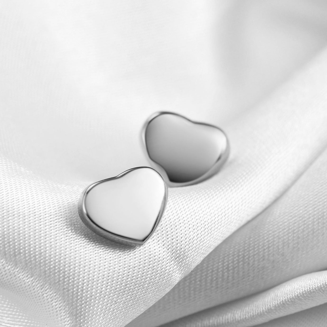 Wholesale simple smooth three-dimensional love titanium steel earrings