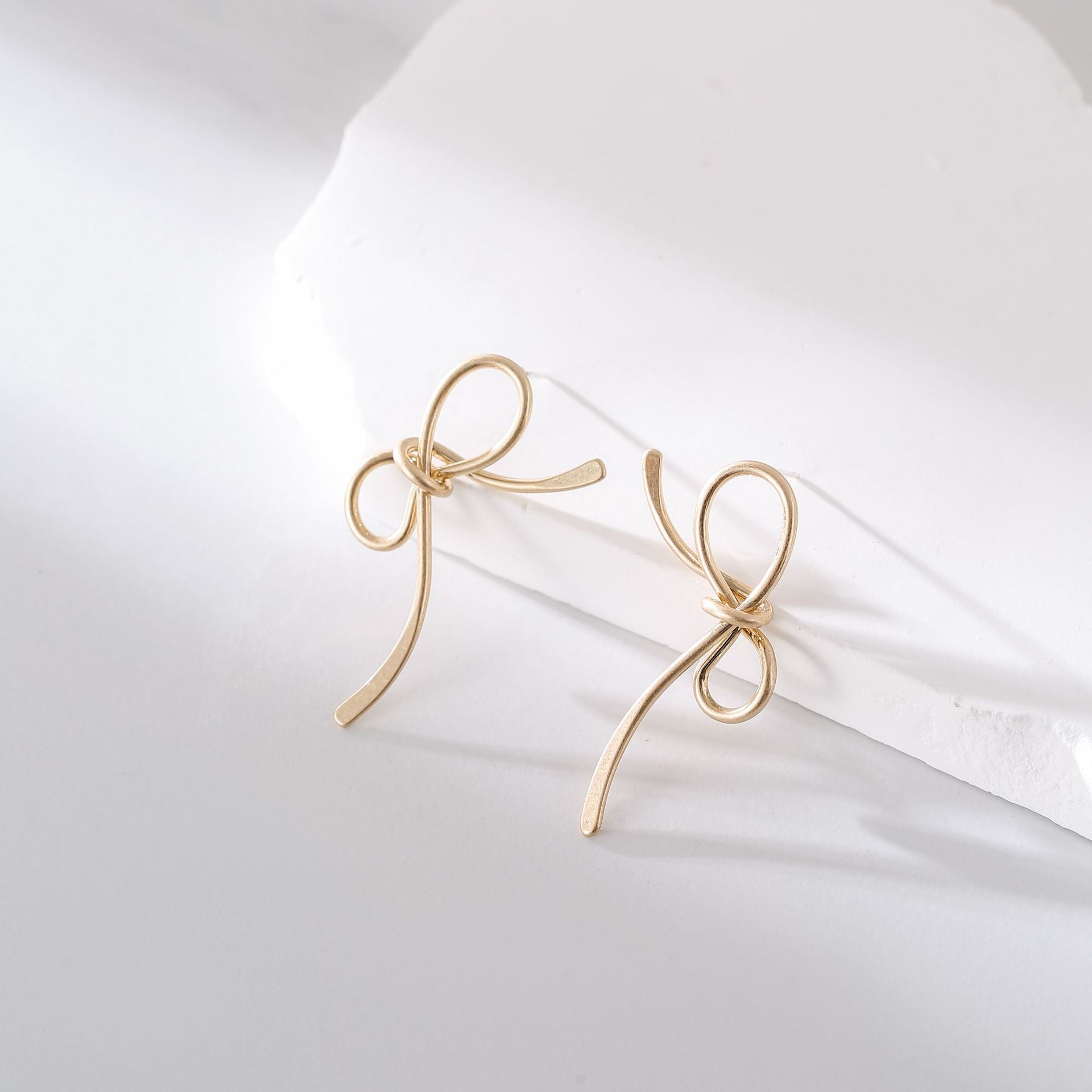 Wholesale Metal Bow Tassel Earrings