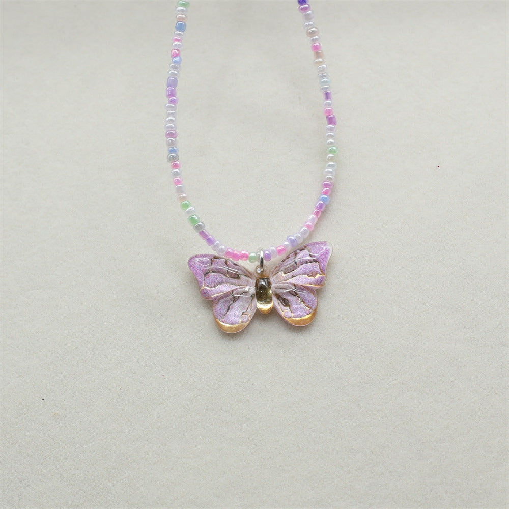 Wholesale gradient color bronzing butterfly sweet pendant rice beads beaded necklace