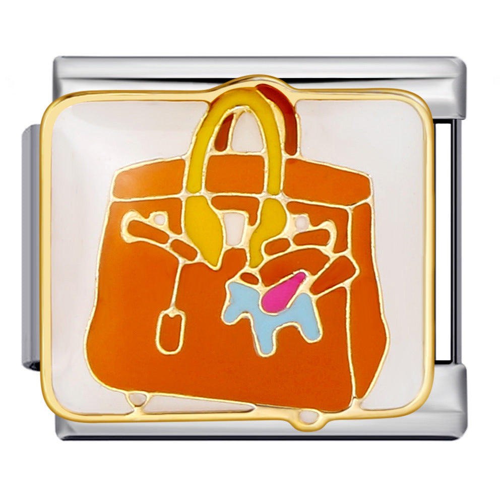 Silver modular link featuring an orange handbag illustration