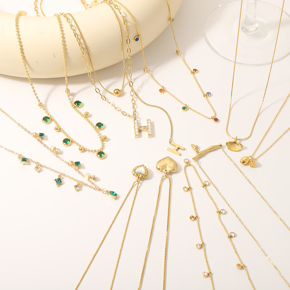 Wholesale stainless steel bamboo love fishtail skirt letter zircon necklace