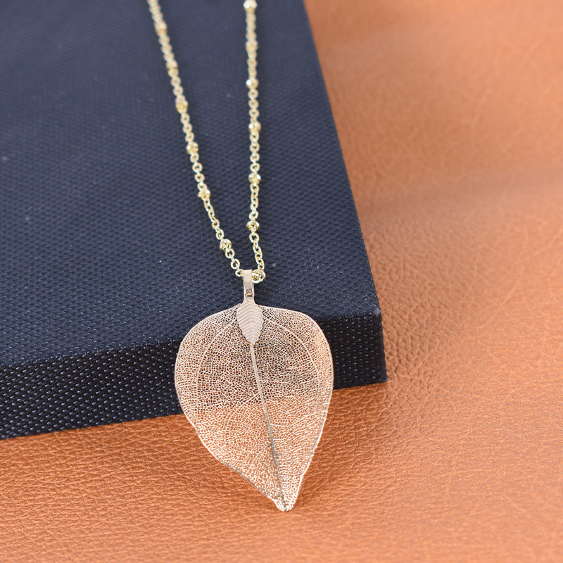 Wholesale simple hollow leaf sweater chain